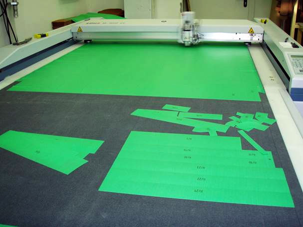 a factory with a dedicated table for cutting materials